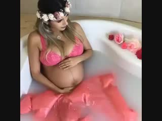 pregnant flower girl in the tub