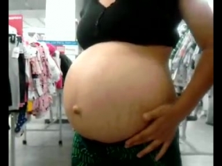 nice sized preggo tummy with a cute popped out belly button