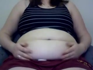 massaging big doughy belly while bloated - more on stufferdb.com